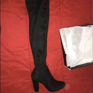 Thigh high black boots